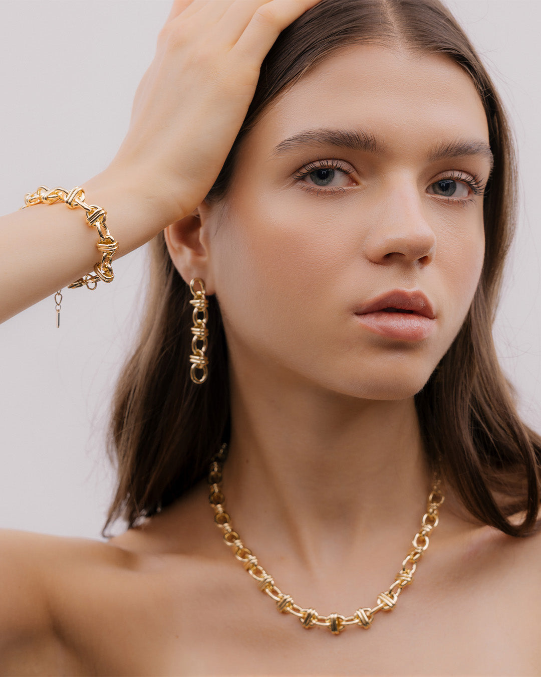 Aretes Eslabones Cruzados