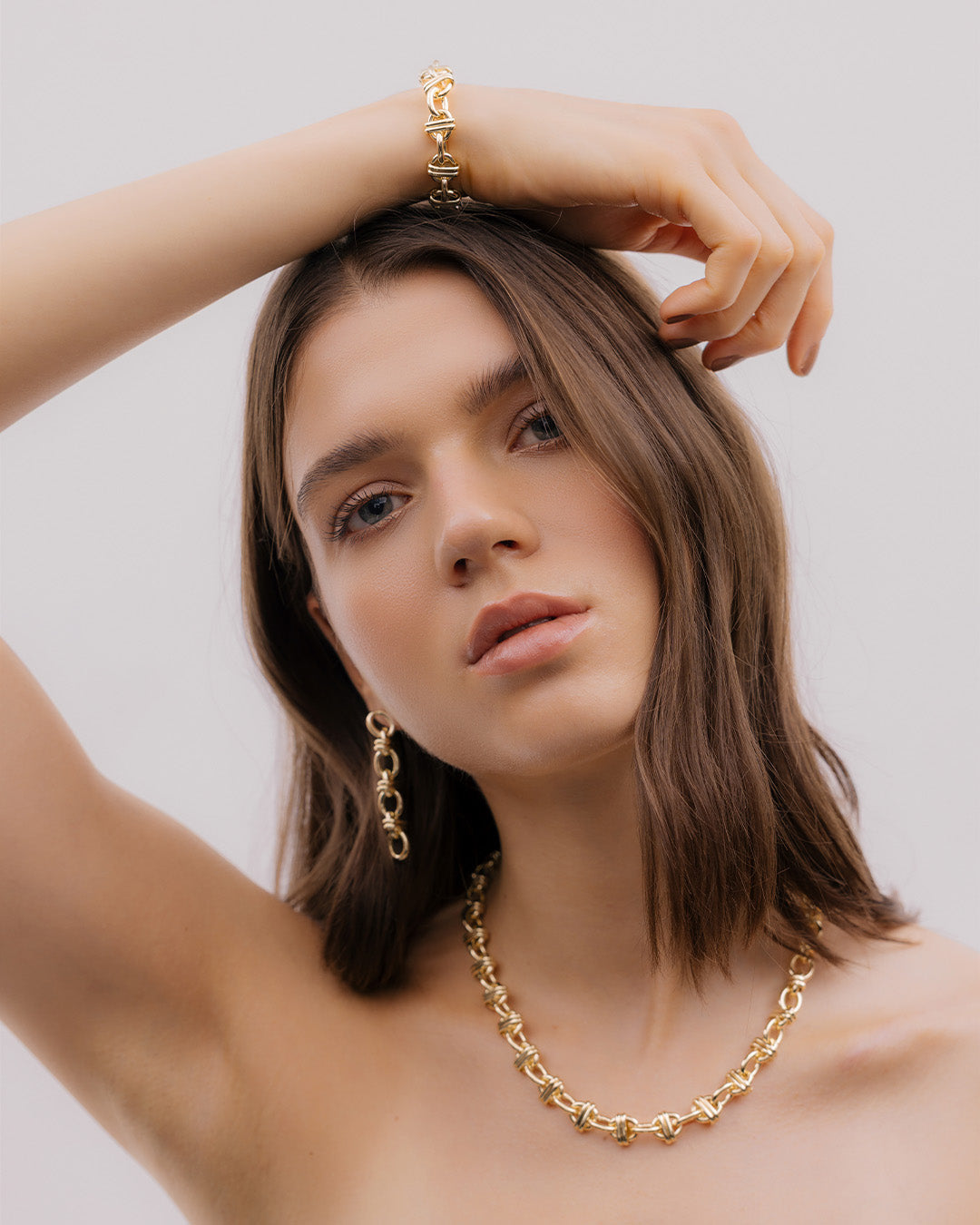 Aretes Eslabones Cruzados